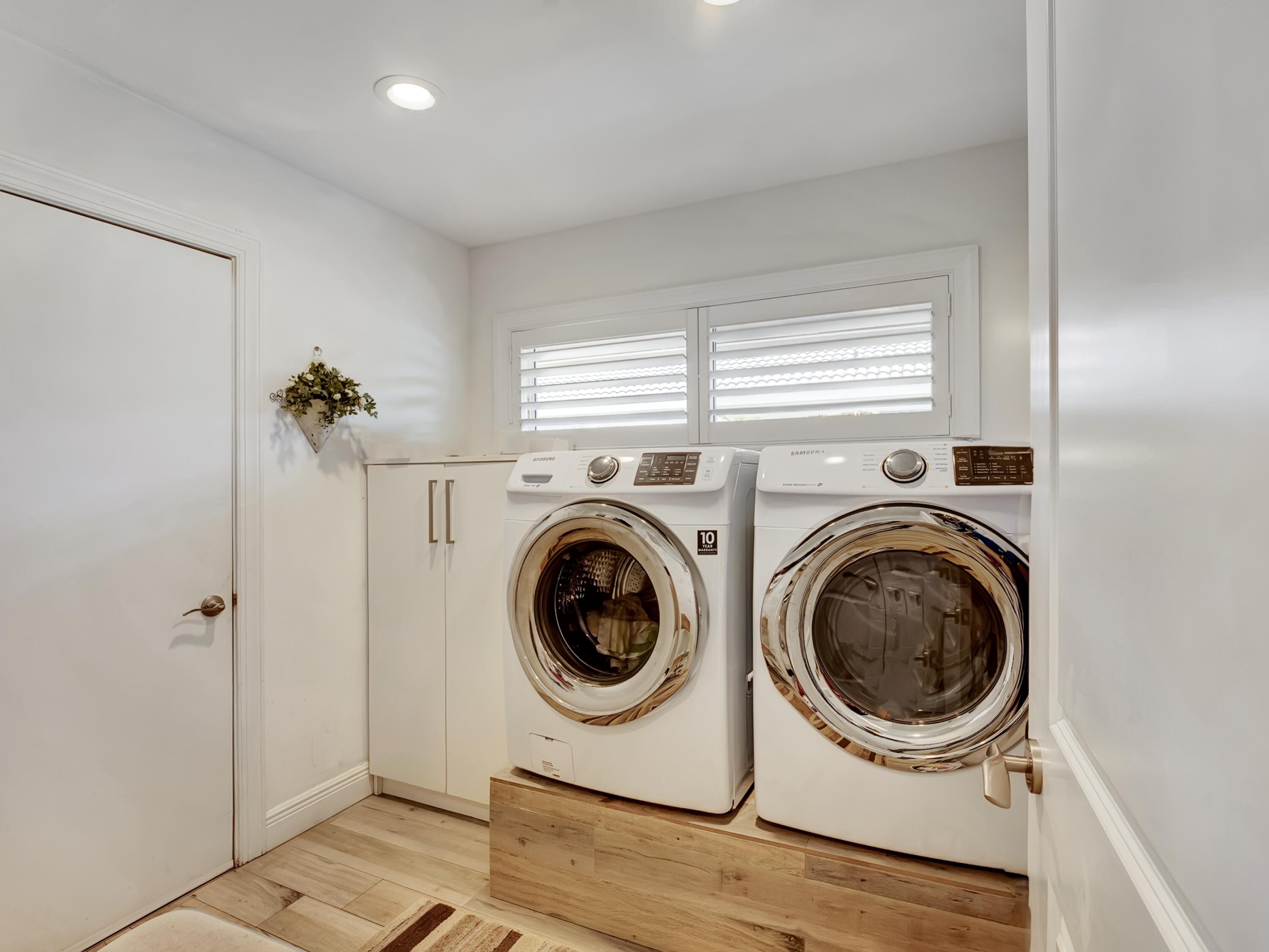 4550 White Cedar Lane Delray Beach, FL 33445 - Photo 32 of 38 a utility room with dryer and washer