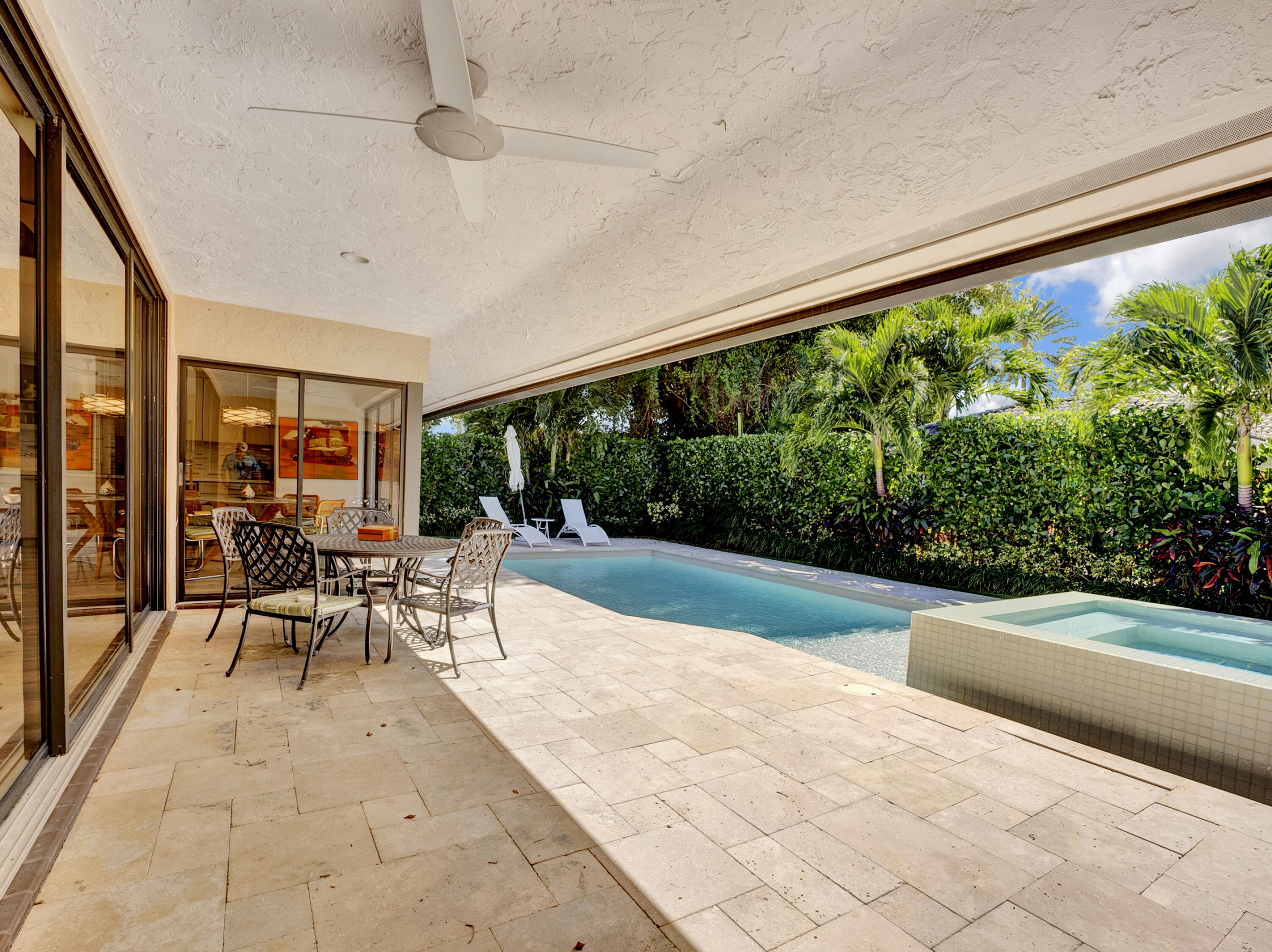 4550 White Cedar Lane Delray Beach, FL 33445 - Photo 33 of 38 a patio with yard glass top table and chairs