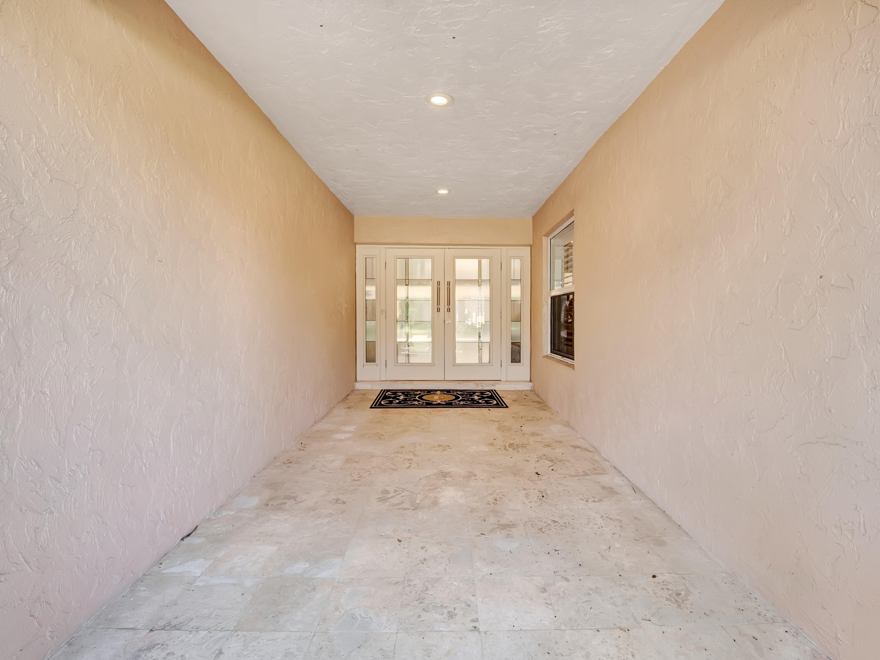 4550 White Cedar Lane Delray Beach, FL 33445 - Photo 6 of 38 an empty room with windows