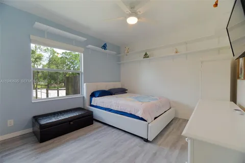 a room with a bed and window