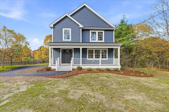 front view of a house with a yard