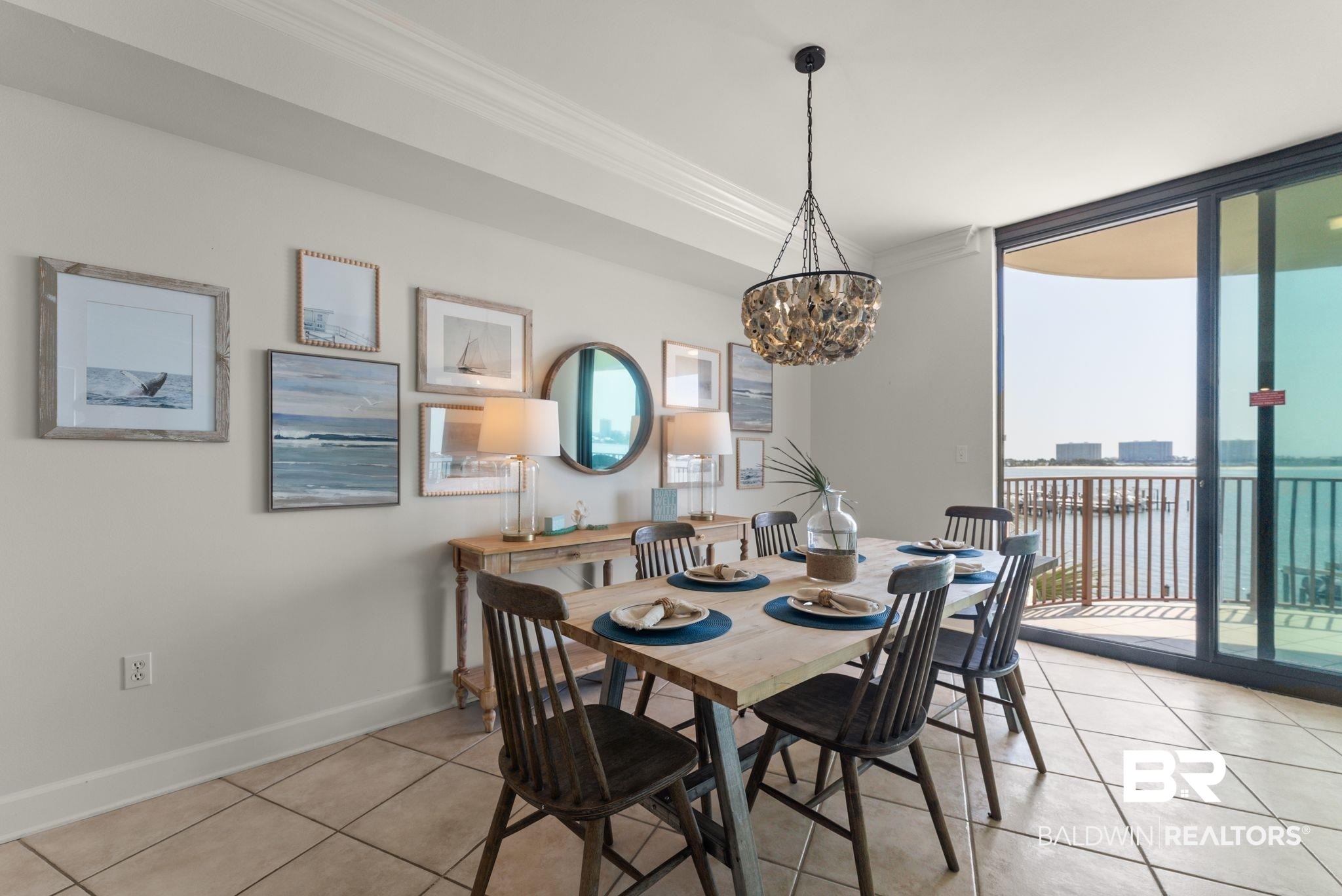 27580 Canal Road, Unit 1233 Orange Beach, AL 36561 - Photo 39 of 79 Dining room featuring floor to ceiling windows, plenty of natural light, ornamental molding, a chandelier, and light tile patterned floors
