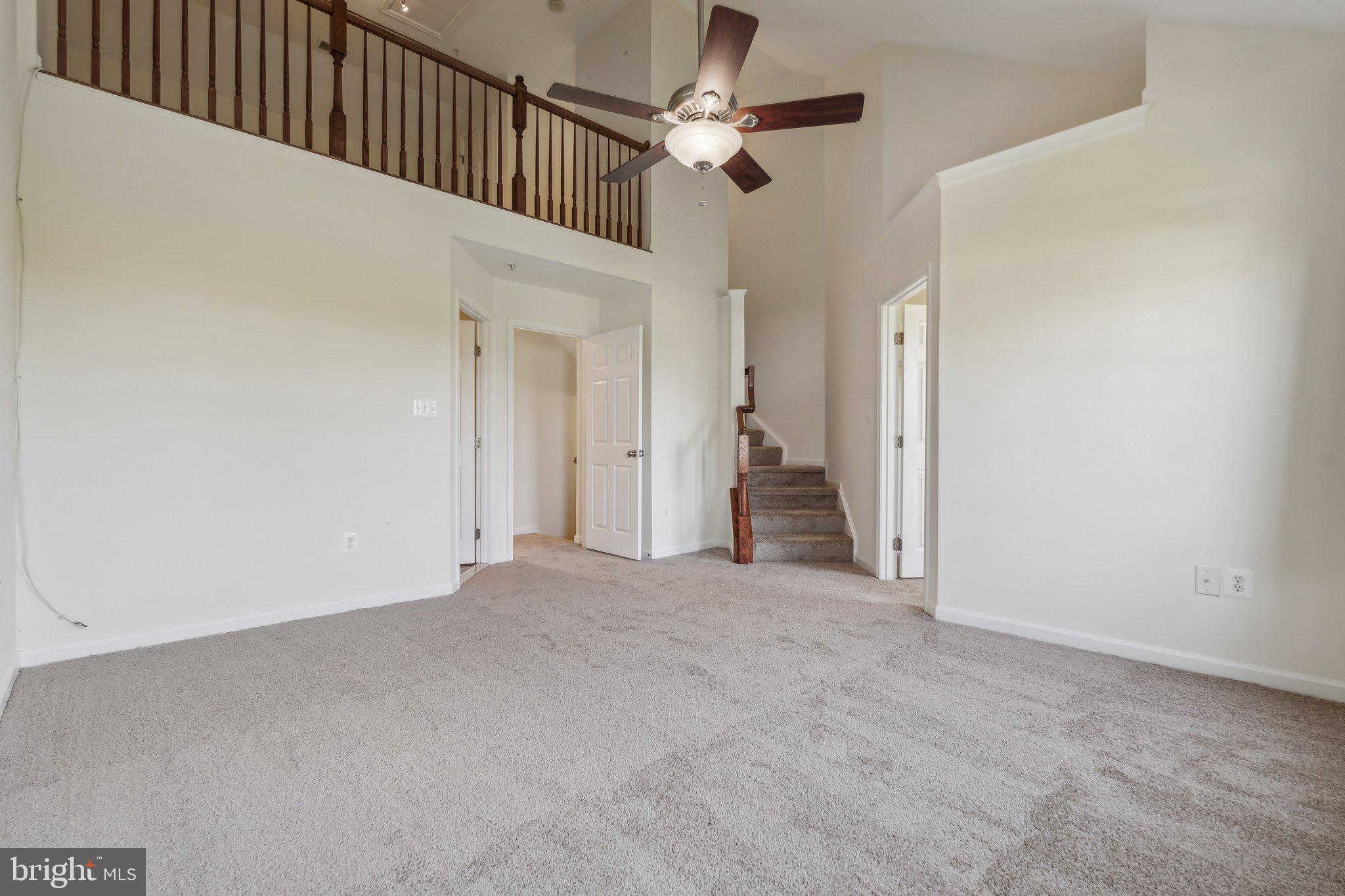 6912 Red Clay Forge, Unit 2 Elkridge, MD 21075 - Photo 13 of 46 a view of a livingroom with a ceiling fan and window