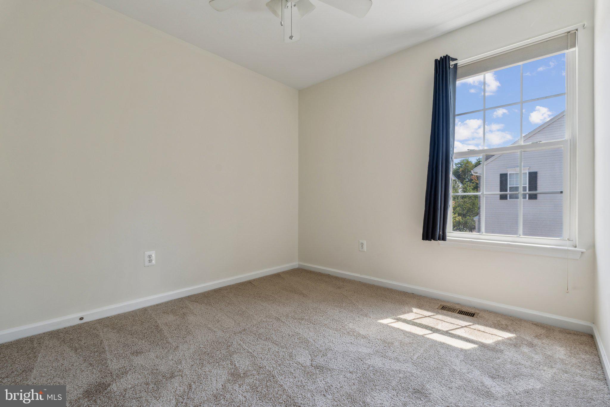 6912 Red Clay Forge, Unit 2 Elkridge, MD 21075 - Photo 21 of 46 a view of an empty room with a window