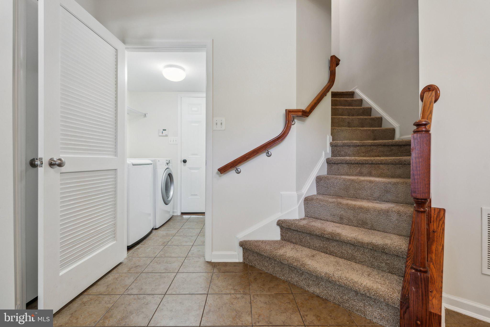 6912 Red Clay Forge, Unit 2 Elkridge, MD 21075 - Photo 22 of 46 a view of entryway and gallery with wooden floor