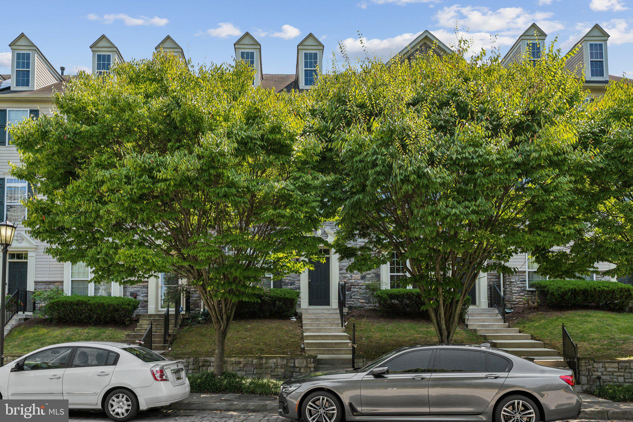 6912 Red Clay Forge, Unit 2 Elkridge, MD 21075 - Photo 25 of 46 a view of a car parked in front of a house