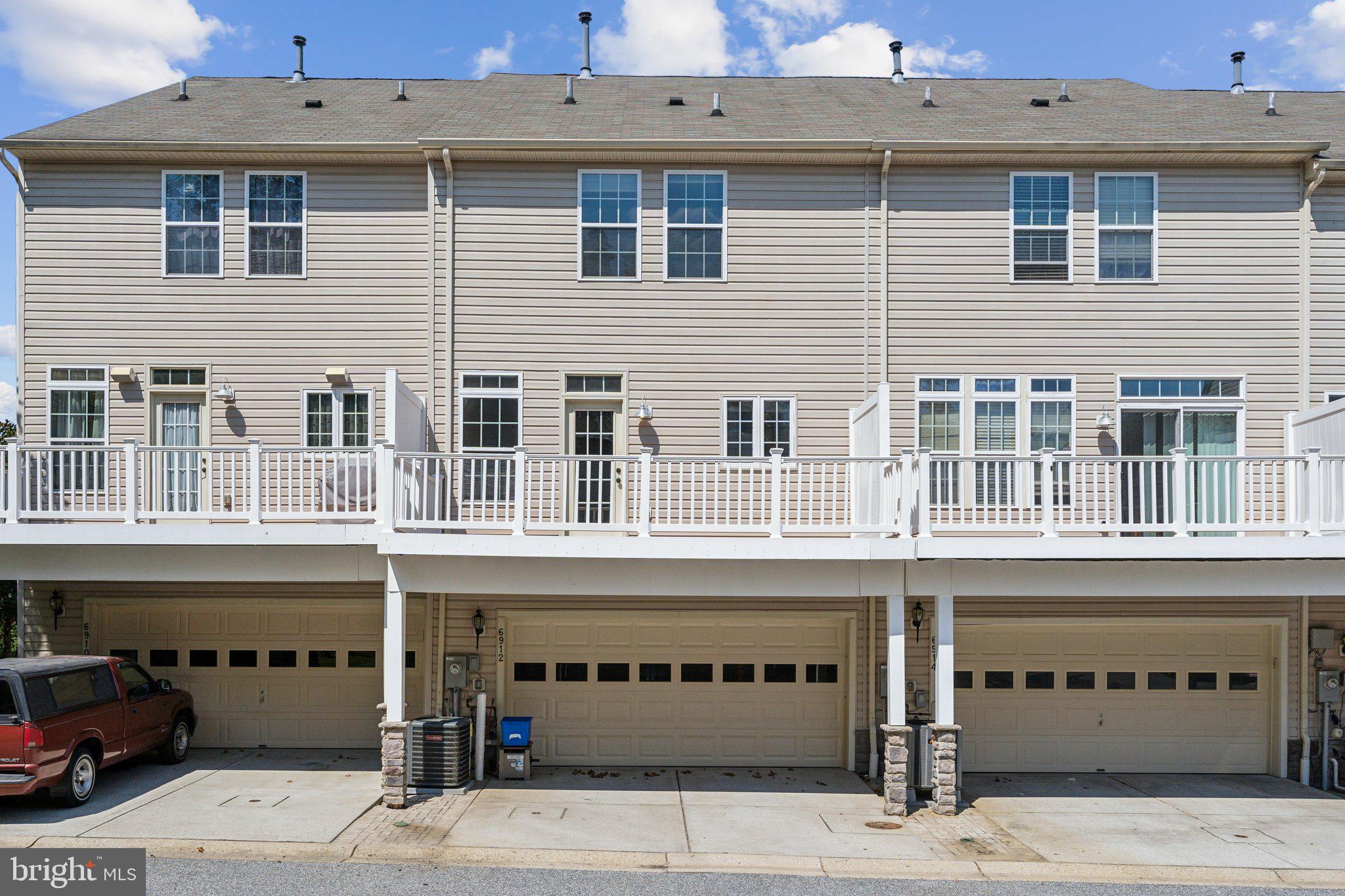 6912 Red Clay Forge, Unit 2 Elkridge, MD 21075 - Photo 3 of 46 a front view of a building with windows