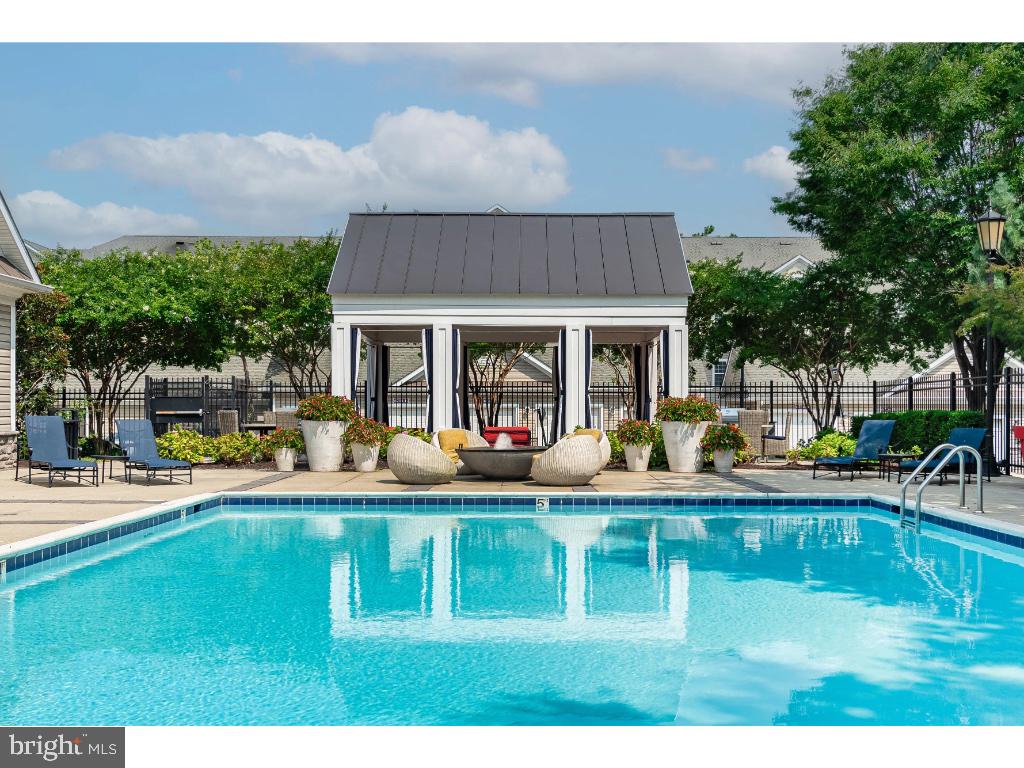 6912 Red Clay Forge, Unit 2 Elkridge, MD 21075 - Photo 32 of 46 a view of a swimming pool with outdoor seating