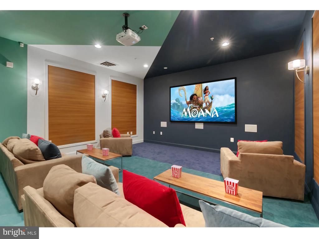 6912 Red Clay Forge, Unit 2 Elkridge, MD 21075 - Photo 35 of 46 a living room with furniture and a flat screen tv