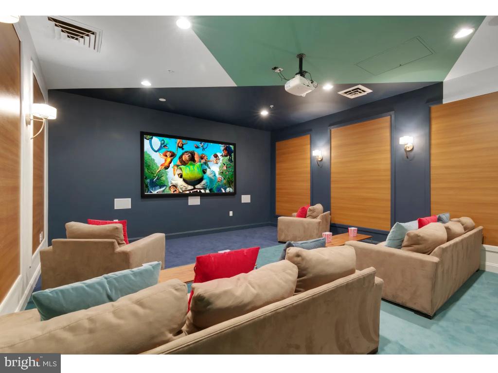 6912 Red Clay Forge, Unit 2 Elkridge, MD 21075 - Photo 36 of 46 a living room with furniture and a flat screen tv