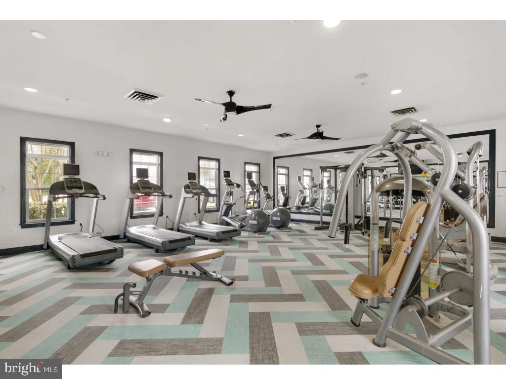 6912 Red Clay Forge, Unit 2 Elkridge, MD 21075 - Photo 39 of 46 a view of a livingroom with dining room and wooden floor