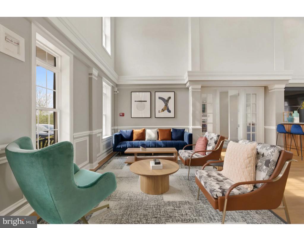 6912 Red Clay Forge, Unit 2 Elkridge, MD 21075 - Photo 41 of 46 a living room with furniture and a large window