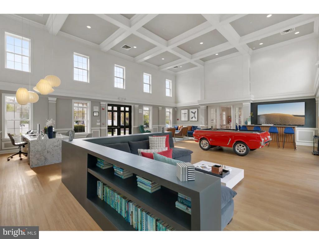 6912 Red Clay Forge, Unit 2 Elkridge, MD 21075 - Photo 42 of 46 a living room with furniture and a chandelier