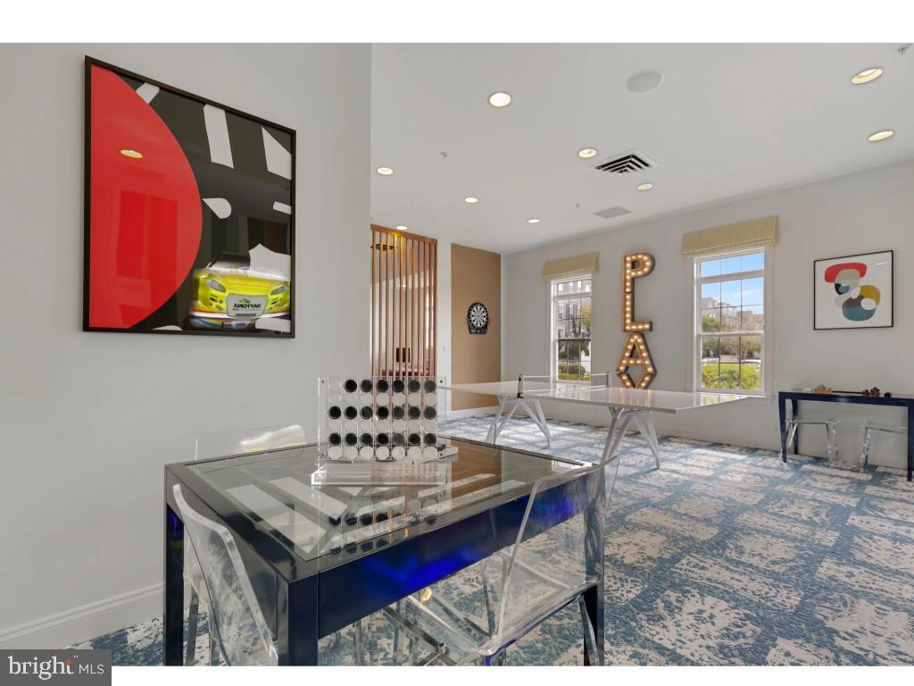 6912 Red Clay Forge, Unit 2 Elkridge, MD 21075 - Photo 45 of 46 a living room with furniture and painting on the wall