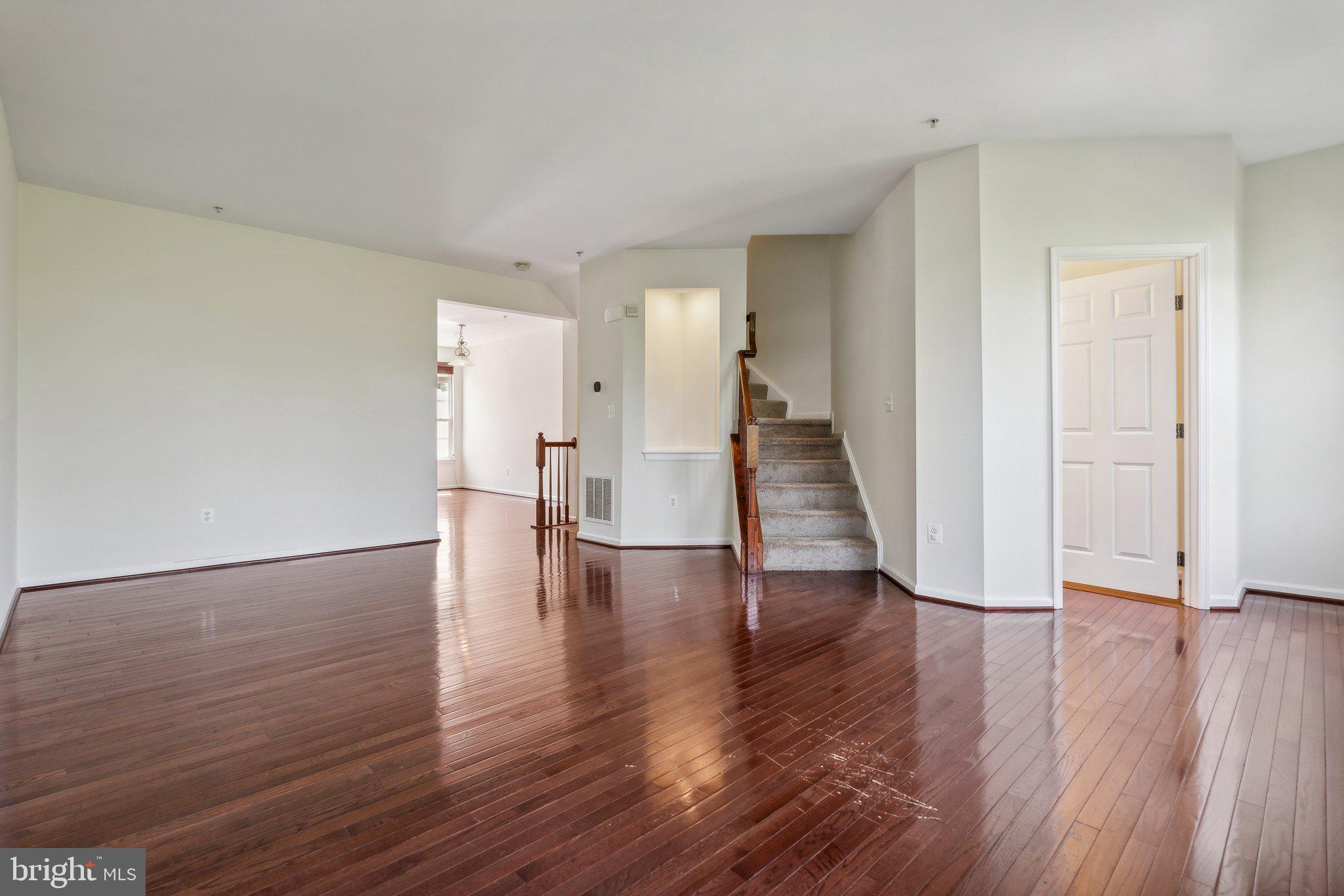 6912 Red Clay Forge, Unit 2 Elkridge, MD 21075 - Photo 10 of 46 a view of empty room with wooden floor