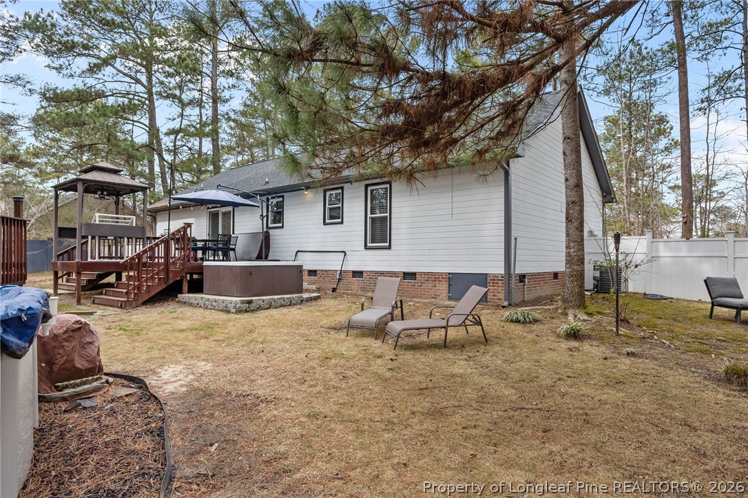 237 Lemuel Black Road Bunnlevel, NC 28323 - Photo 26 of 37 a view of a house with a yard patio and sitting area