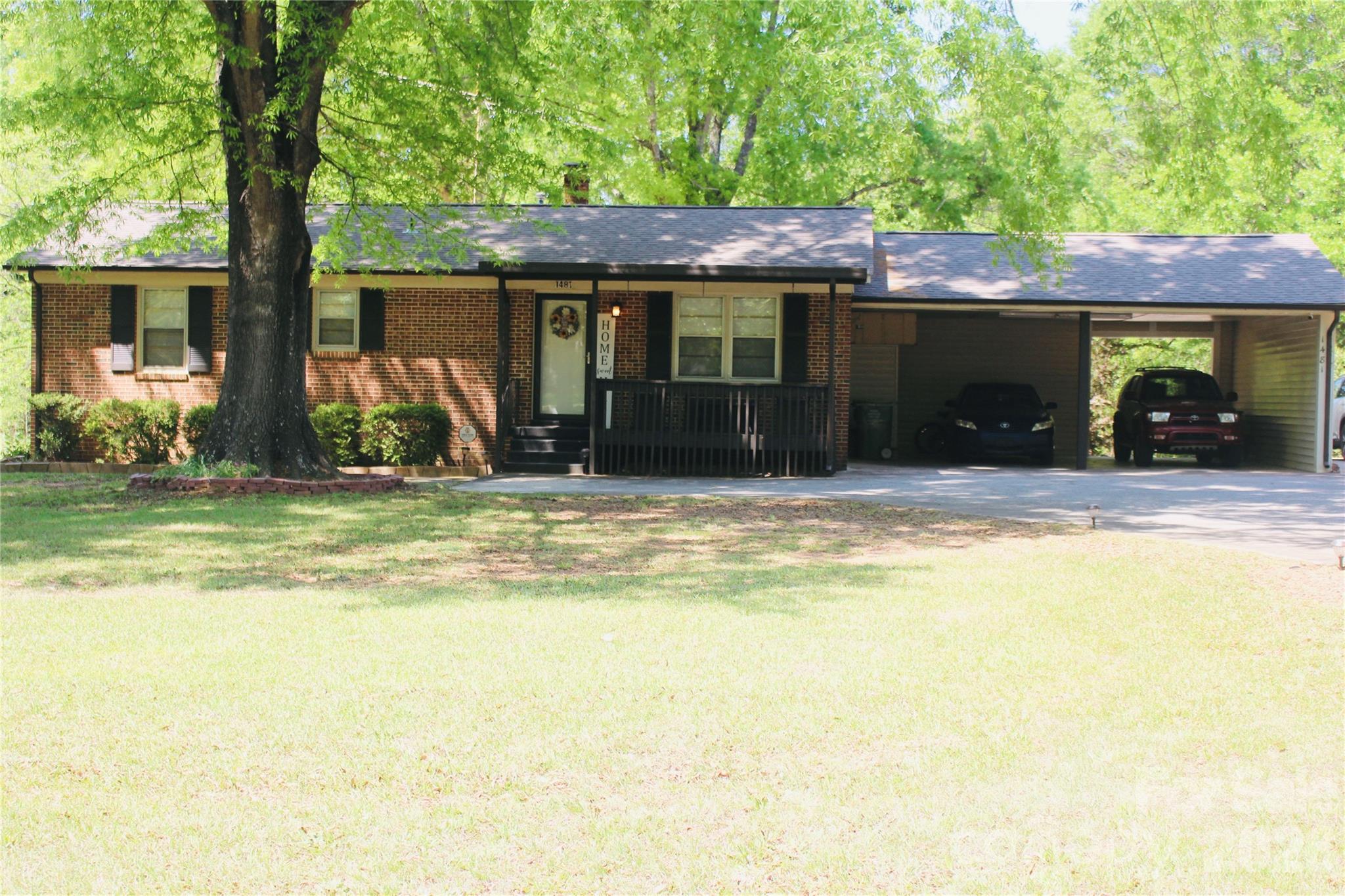 1481 Grace Avenue Lancaster, SC 29720 - Photo 1 of 22 a view of a house with a swimming pool