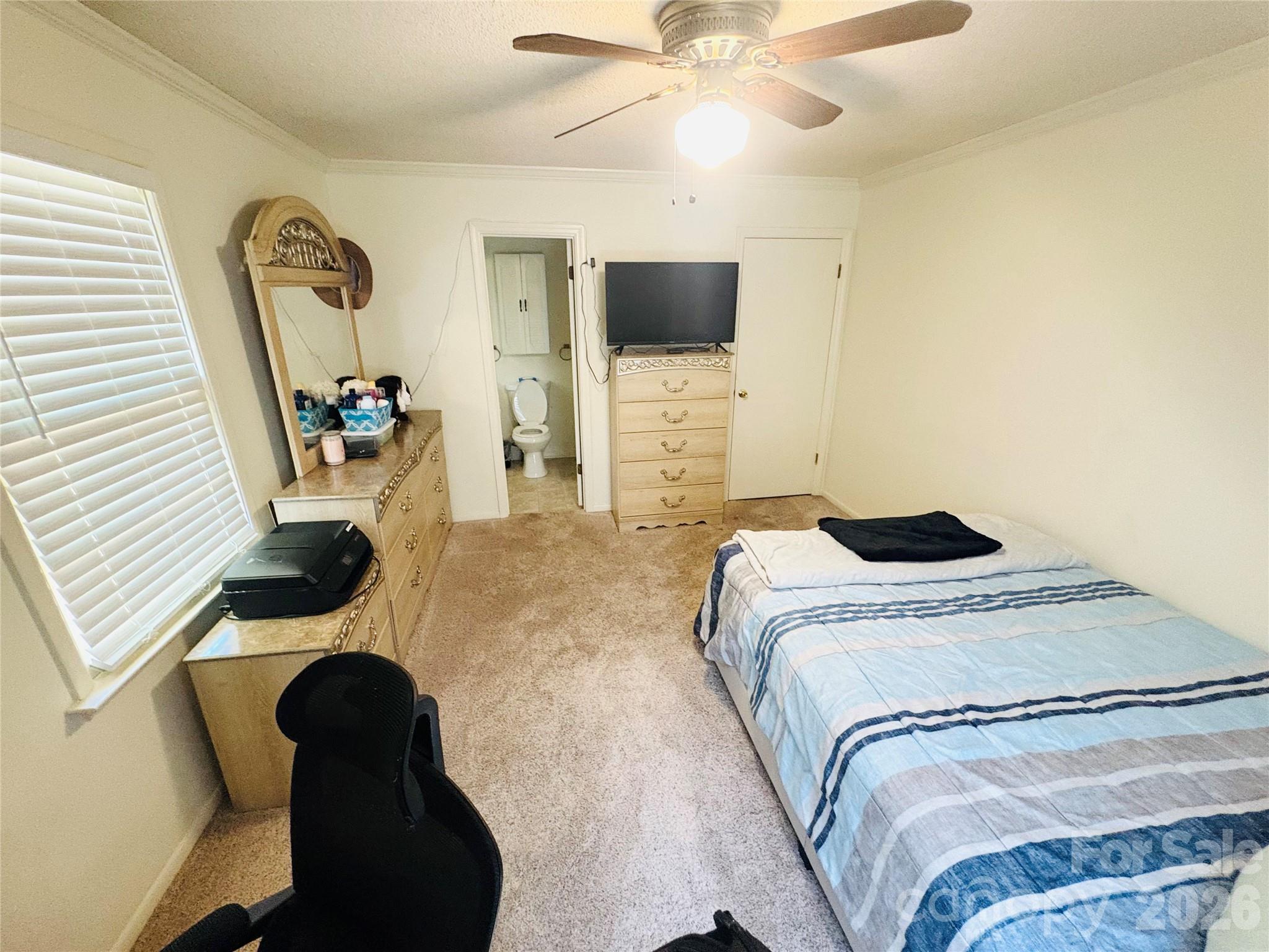 1481 Grace Avenue Lancaster, SC 29720 - Photo 17 of 22 a bedroom with a bed and a flat screen tv