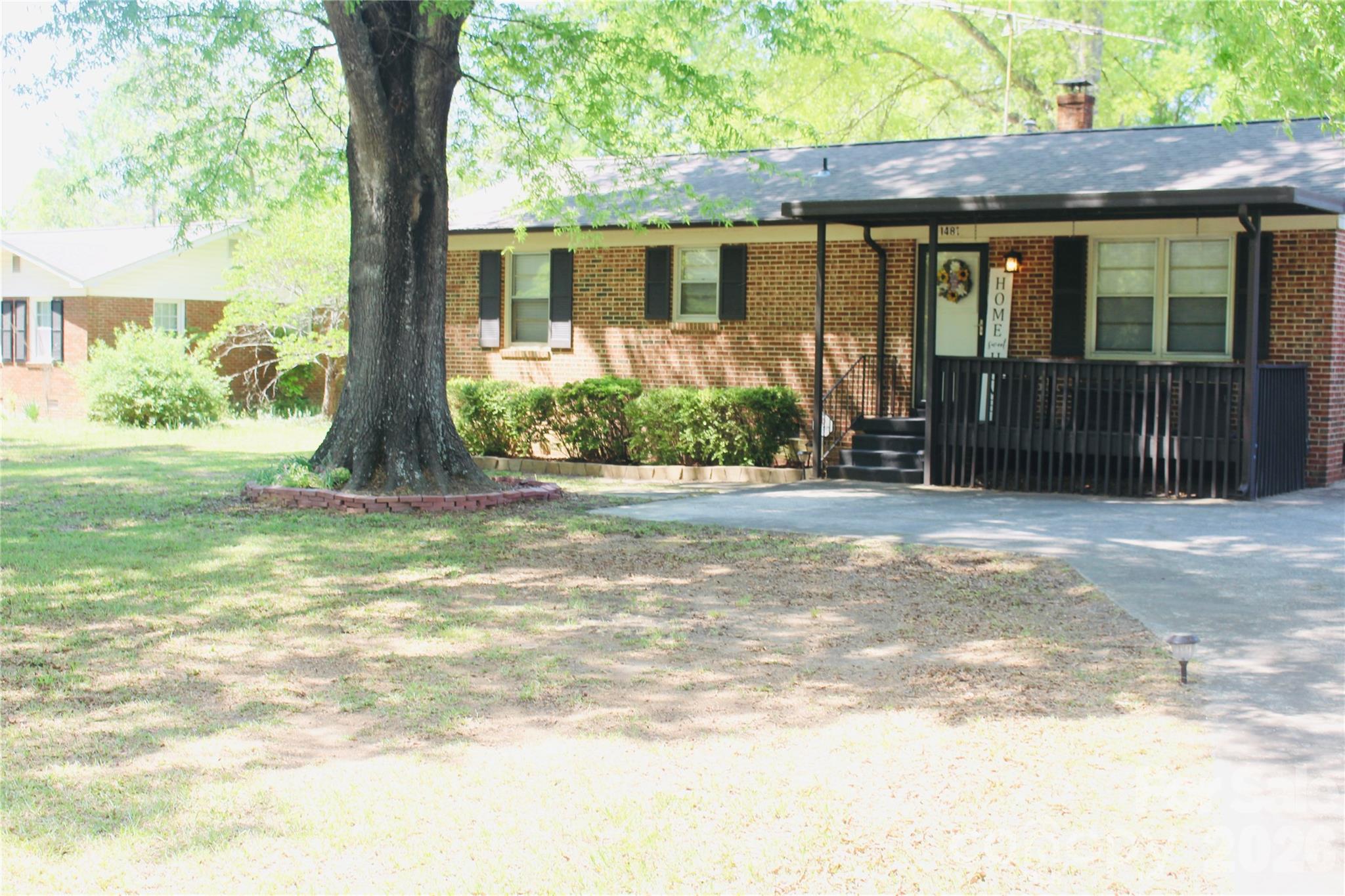 1481 Grace Avenue Lancaster, SC 29720 - Photo 2 of 22 a front view of a house with a yard