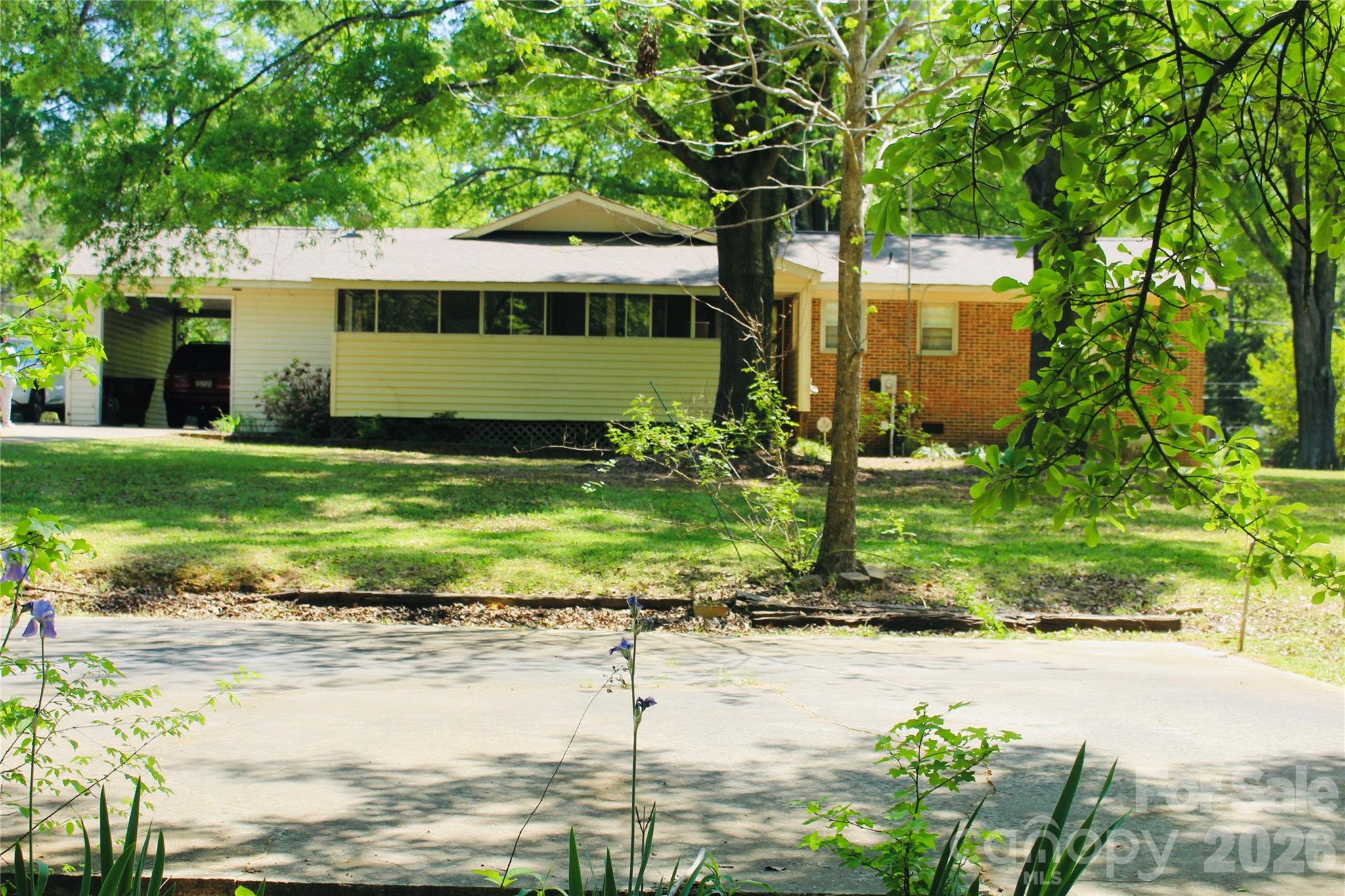 1481 Grace Avenue Lancaster, SC 29720 - Photo 4 of 22 a front view of a house with a yard and potted plants