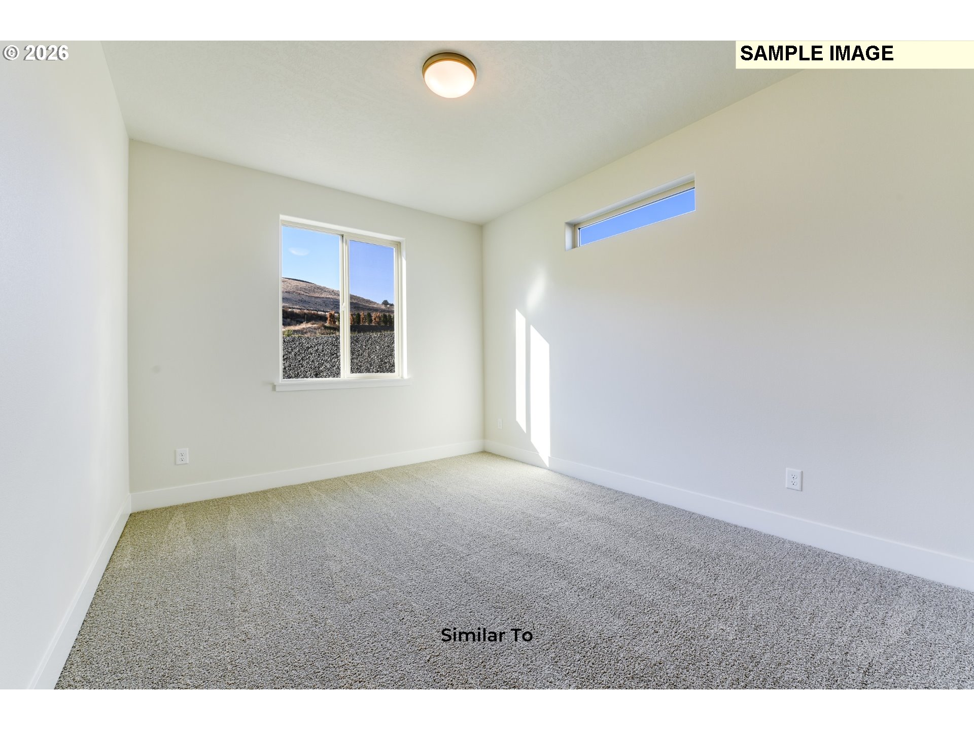 215 Southwest Sparrow Street Boardman, OR 97818 - Photo 14 of 28 a view of an empty room with a window