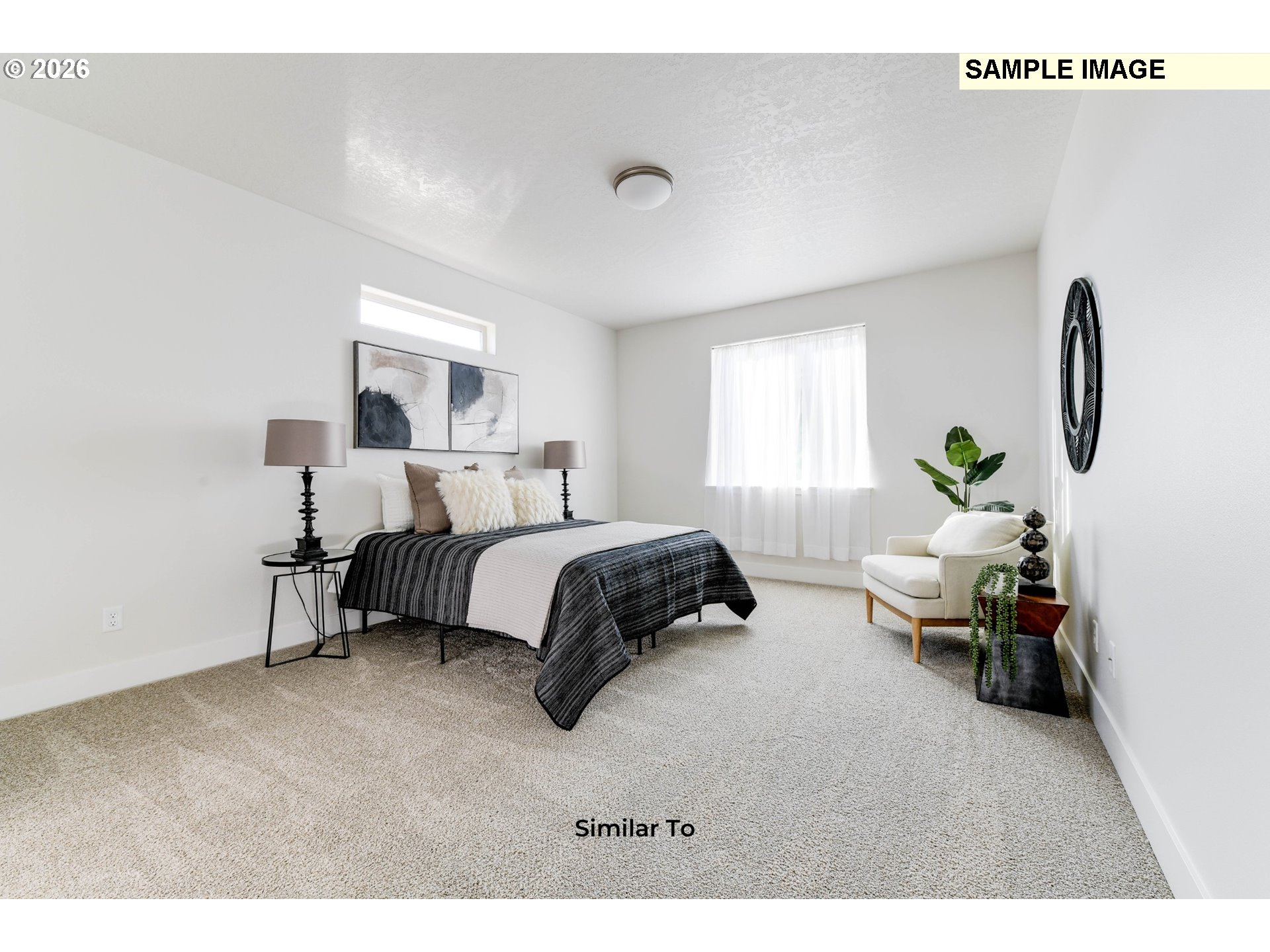 215 Southwest Sparrow Street Boardman, OR 97818 - Photo 16 of 28 a bedroom with a bed lamp and furniture