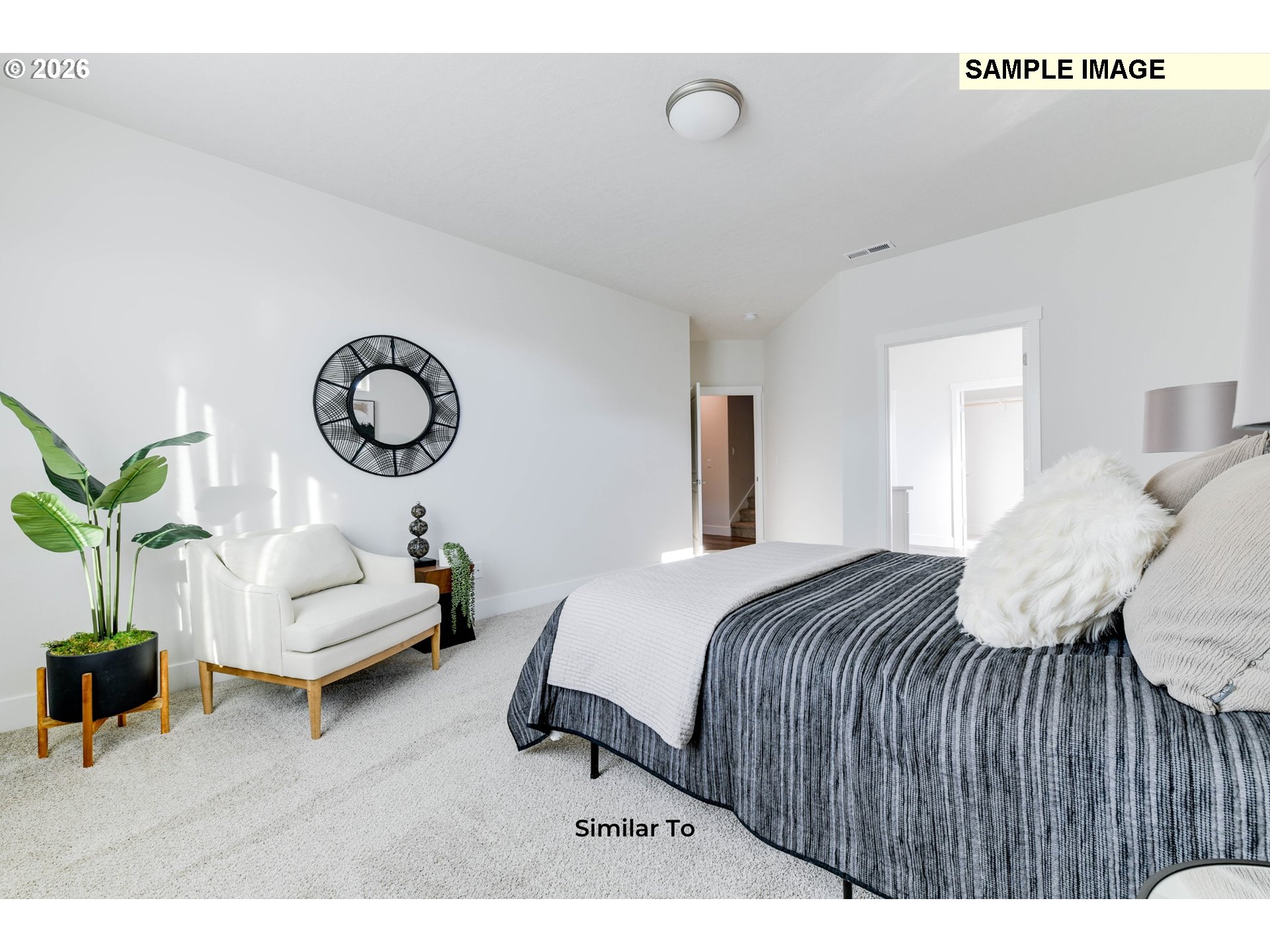 215 Southwest Sparrow Street Boardman, OR 97818 - Photo 18 of 28 a bedroom with a bed and a chandelier