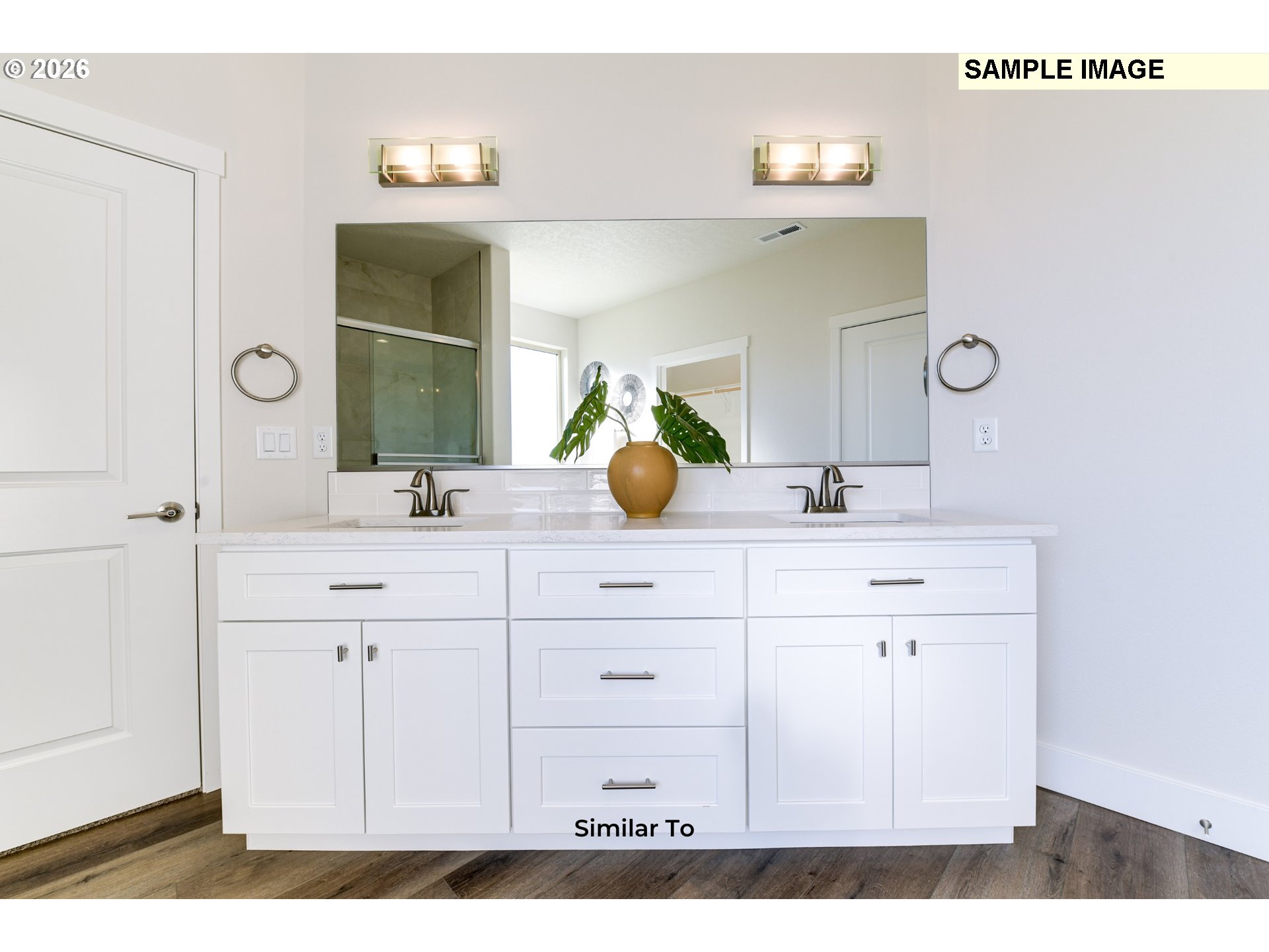 215 Southwest Sparrow Street Boardman, OR 97818 - Photo 19 of 28 a bathroom with a sink vanity and a mirror