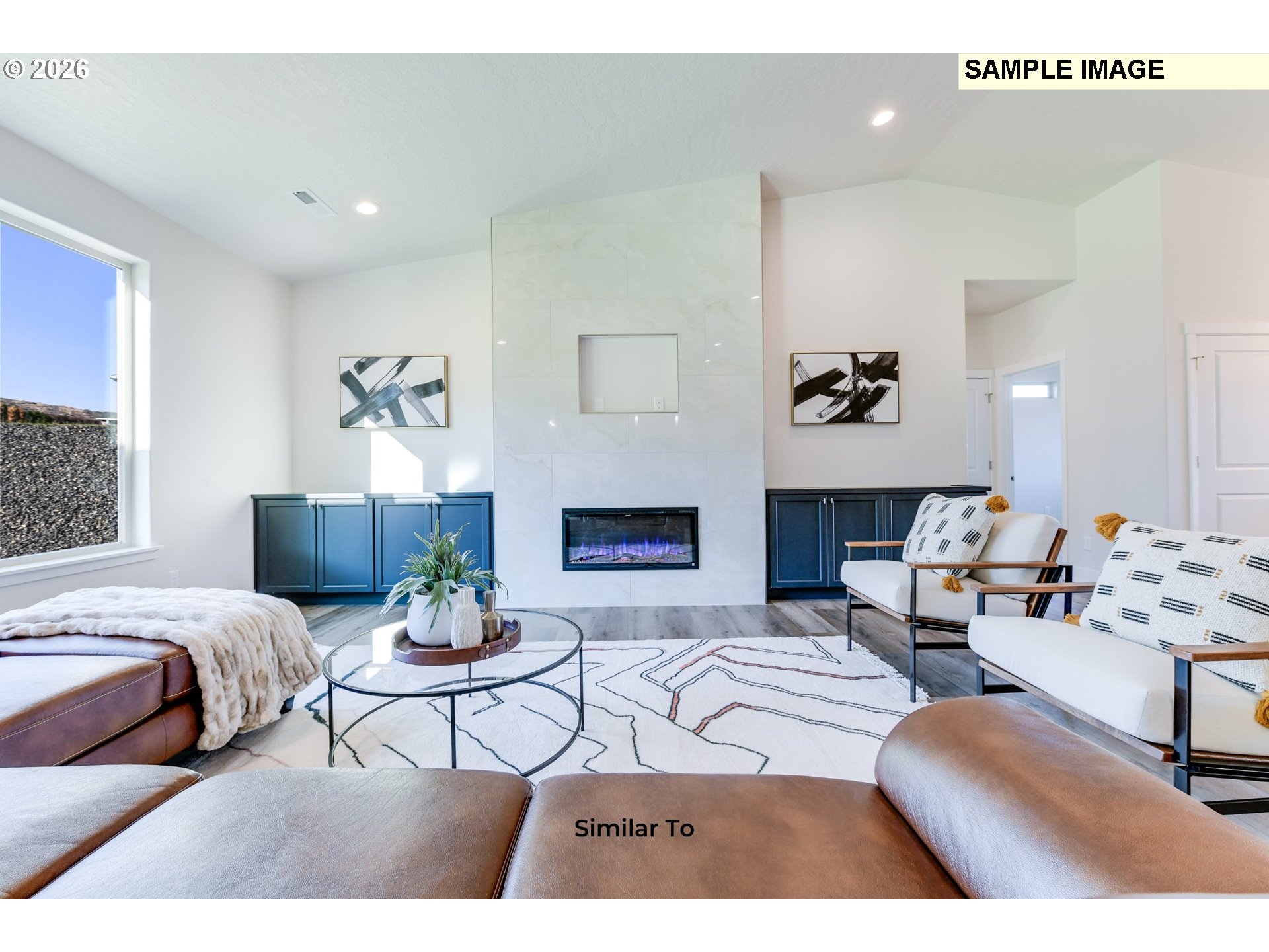 215 Southwest Sparrow Street Boardman, OR 97818 - Photo 25 of 28 a living room with furniture and a fireplace