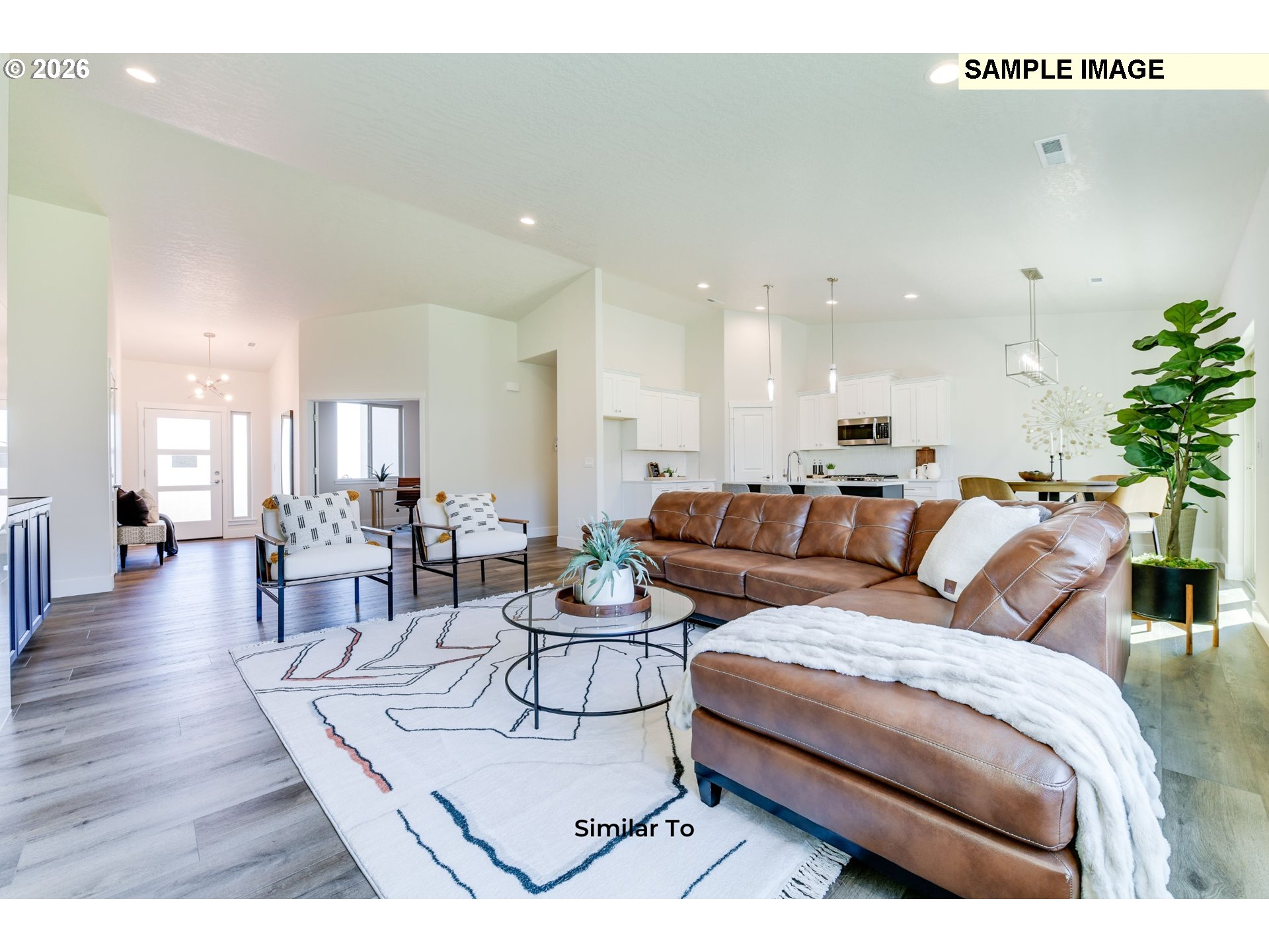 215 Southwest Sparrow Street Boardman, OR 97818 - Photo 27 of 28 a living room with furniture wooden floor and a large window