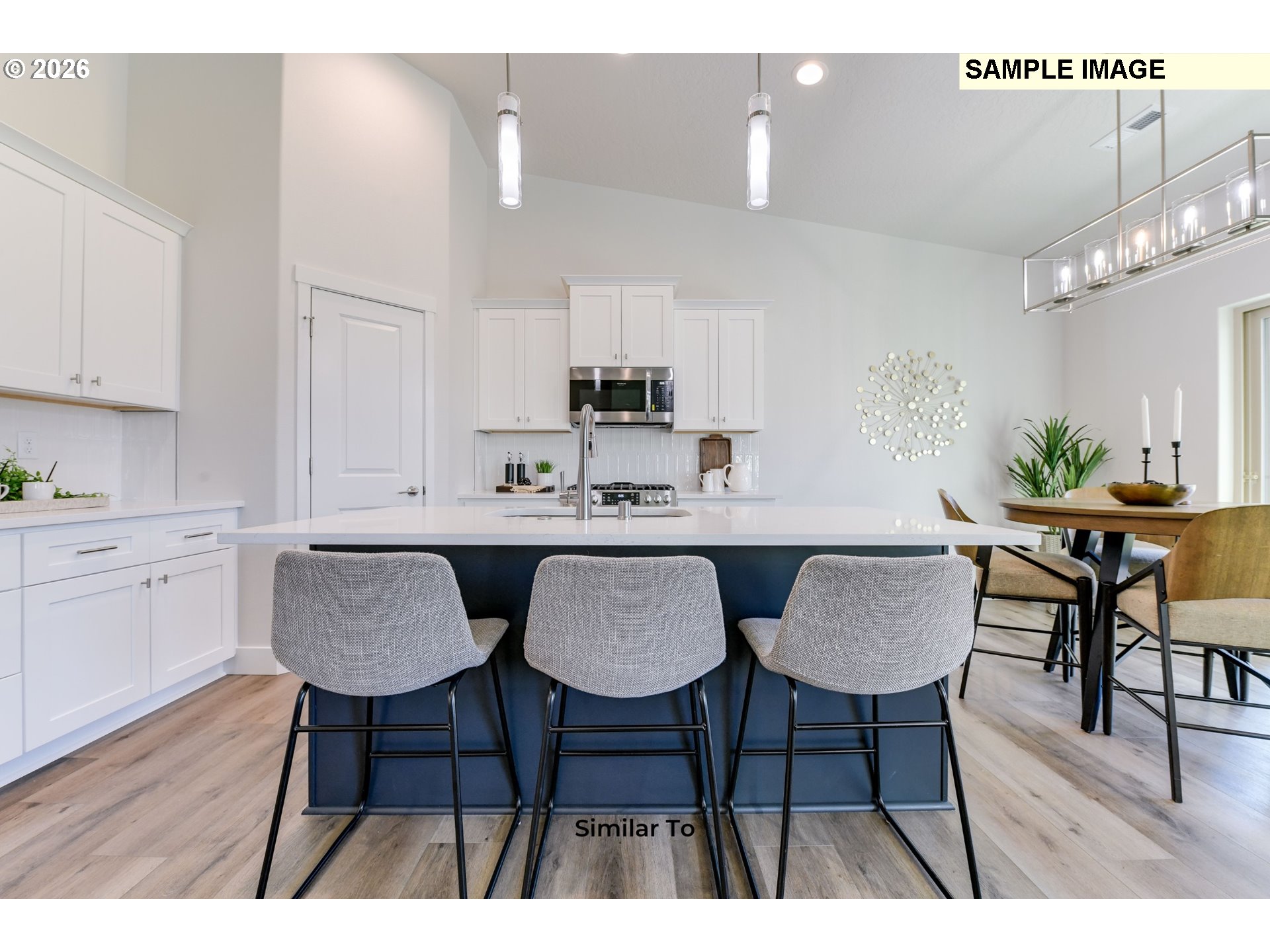 215 Southwest Sparrow Street Boardman, OR 97818 - Photo 5 of 28 a view of kitchen and dining area with furniture