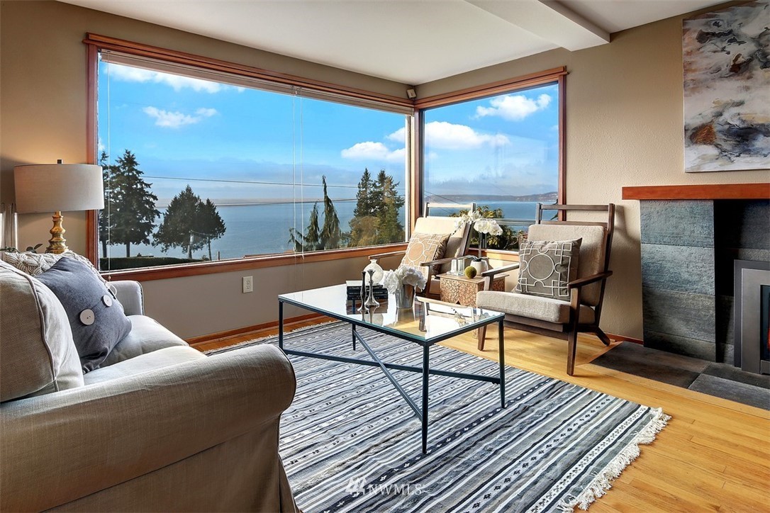 17041 Talbot Road Edmonds, WA 98026 - Photo 9 of 25 a living room with furniture a rug and a large window