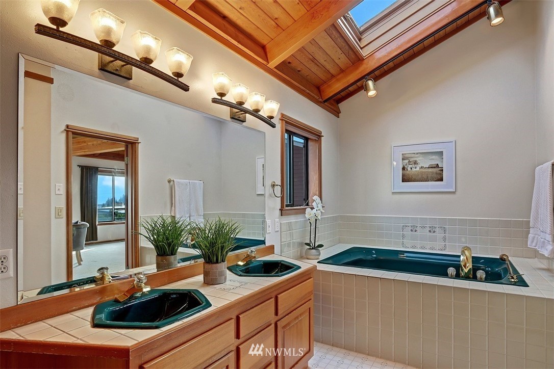 17041 Talbot Road Edmonds, WA 98026 - Photo 10 of 25 a kitchen that has a sink and a stove with wooden floor