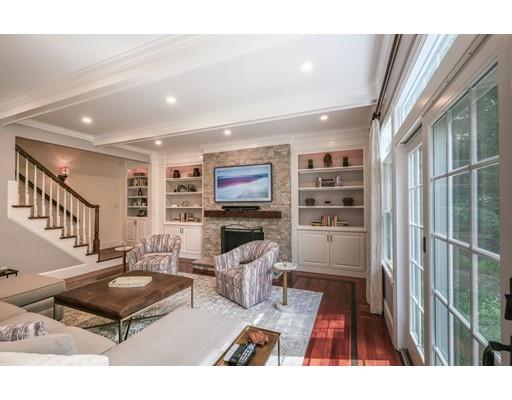51 Plain Road Wayland, MA 01778 - Photo 3 of 8 a living room with furniture a flat screen tv and a rug
