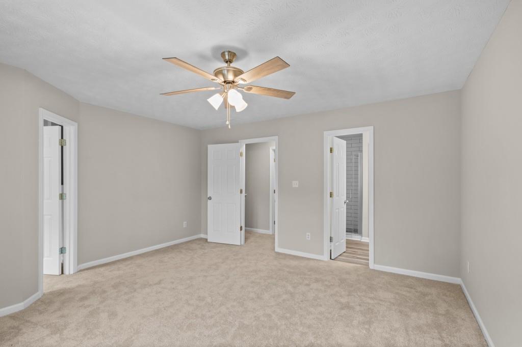 3525 Magnolia Walk Trail Cumming, GA 30040 - Photo 14 of 31 a view of an empty room with a fan