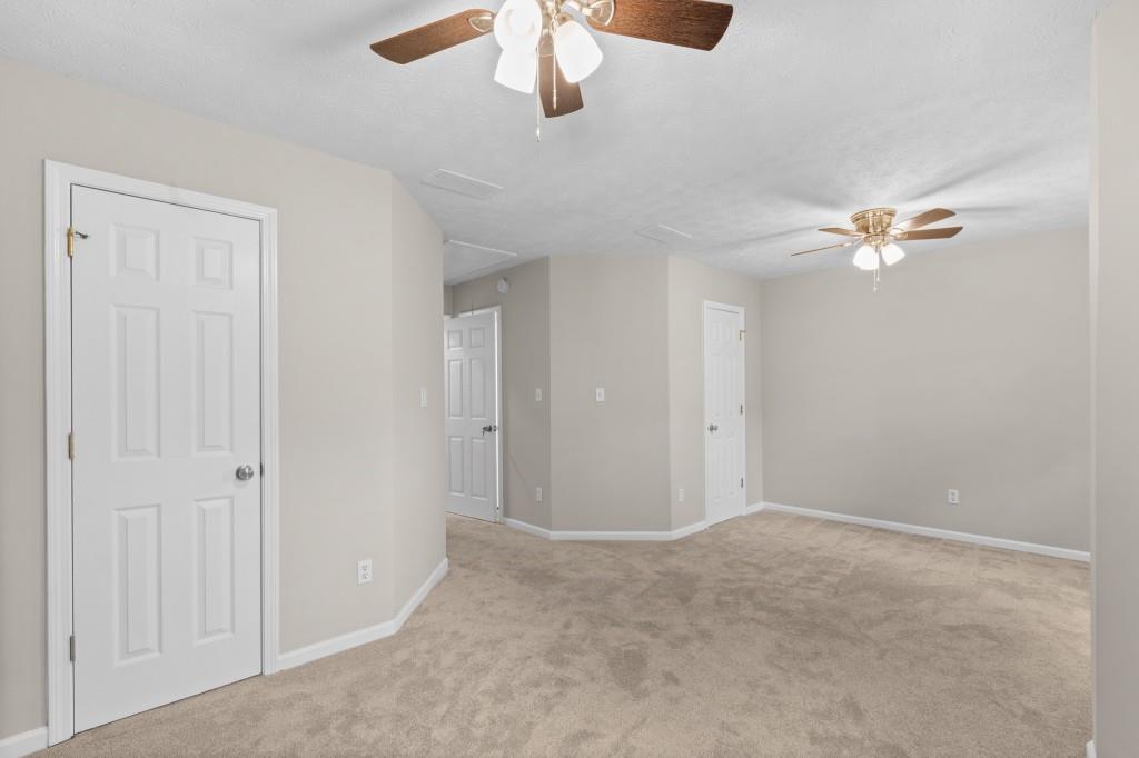 3525 Magnolia Walk Trail Cumming, GA 30040 - Photo 18 of 31 a view of a livingroom with a ceiling fan and window