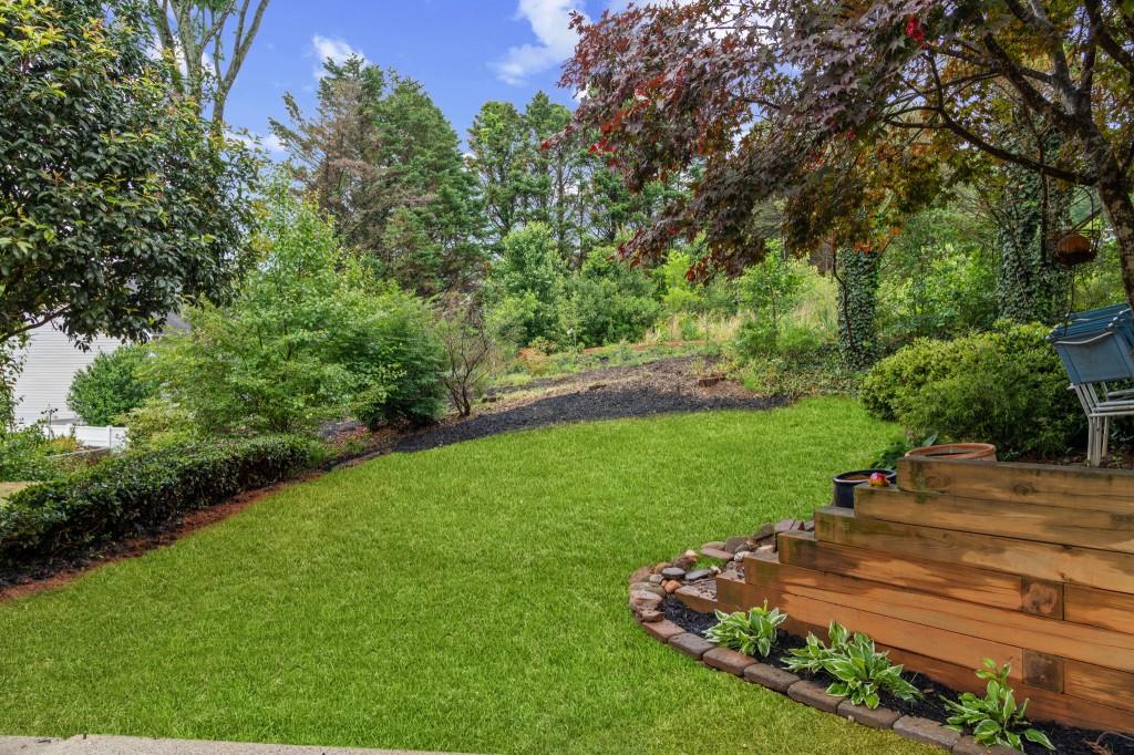 3525 Magnolia Walk Trail Cumming, GA 30040 - Photo 23 of 31 a view of a garden with lawn chairs