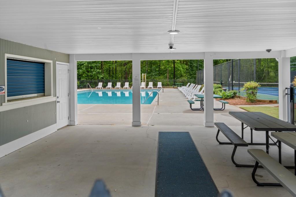3525 Magnolia Walk Trail Cumming, GA 30040 - Photo 24 of 31 a view of a patio with a table chairs and a backyard