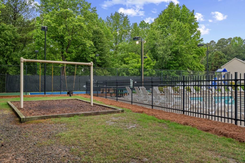 3525 Magnolia Walk Trail Cumming, GA 30040 - Photo 26 of 31 a view of a backyard with swimming pool and sitting area