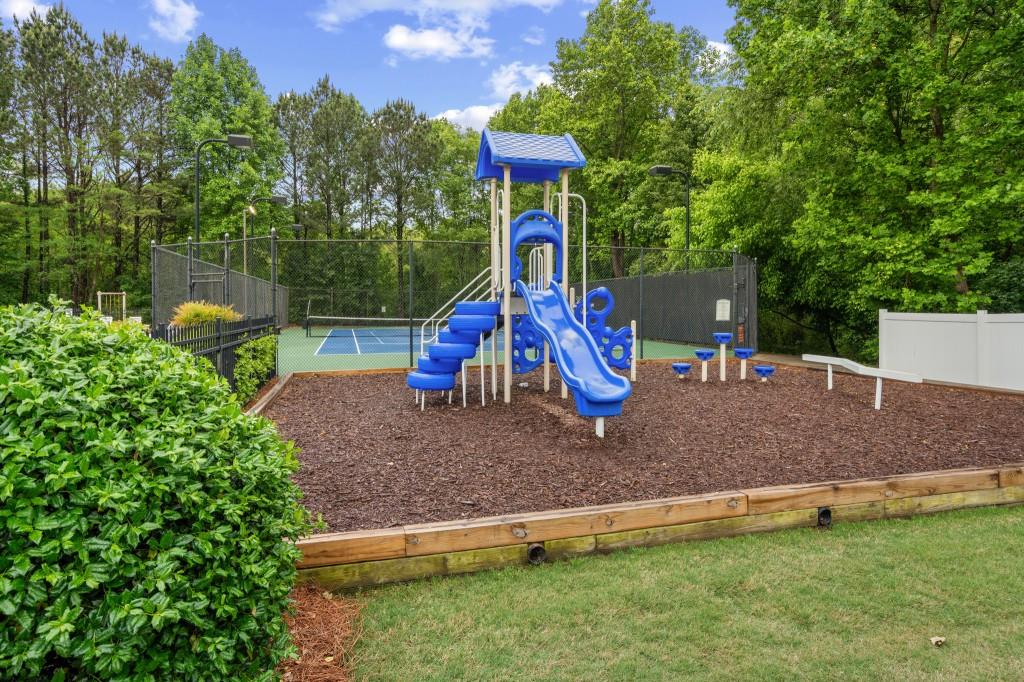 3525 Magnolia Walk Trail Cumming, GA 30040 - Photo 28 of 31 a view of outdoor space with playground and green space