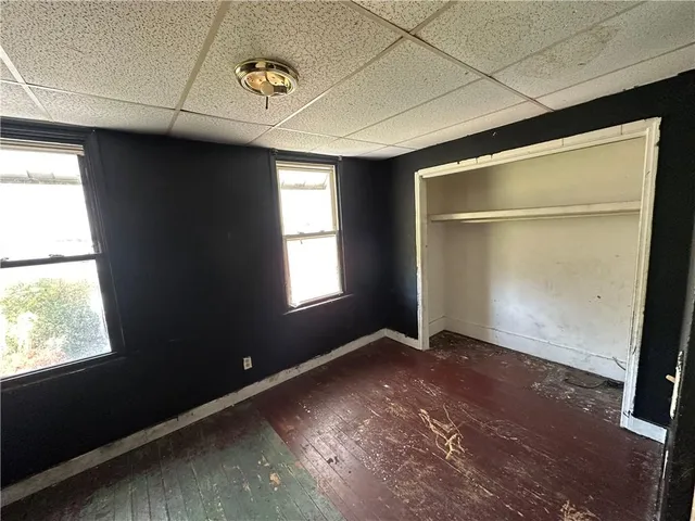 a view of empty room with a fireplace