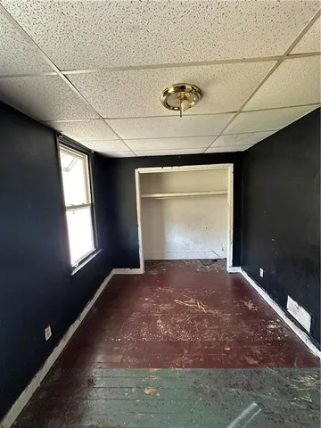 a white toilet sitting next to a bathroom sink