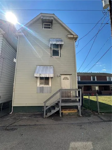 a view of backyard with sitting area