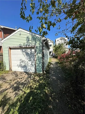 a view of a house with a tree