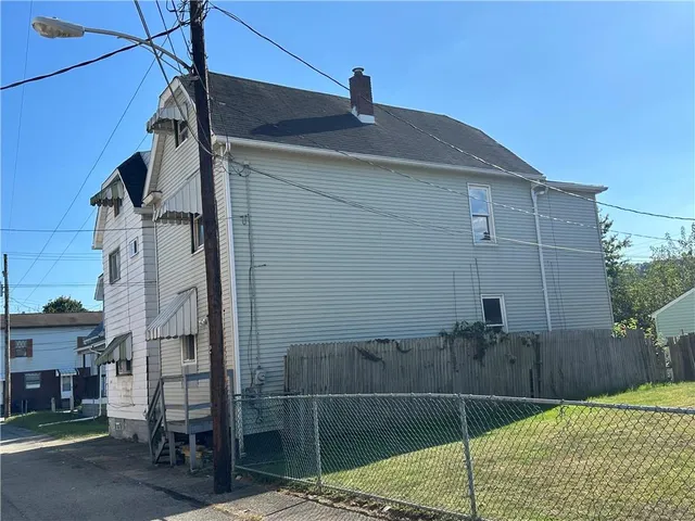 a kitchen with kitchen island a sink appliances and cabinets