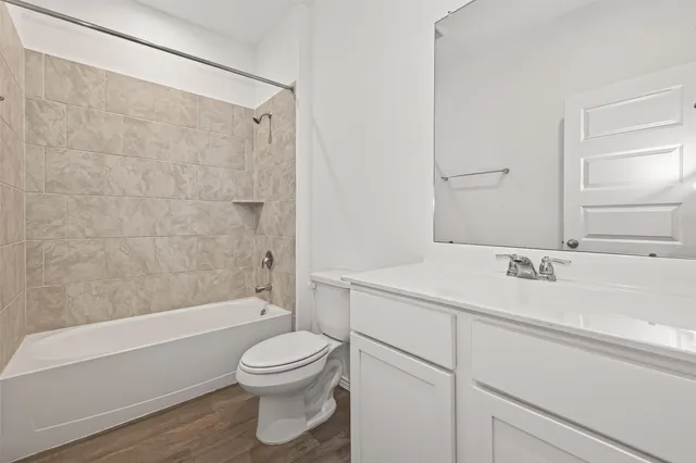 a bathroom with a sink a toilet and a bathtub