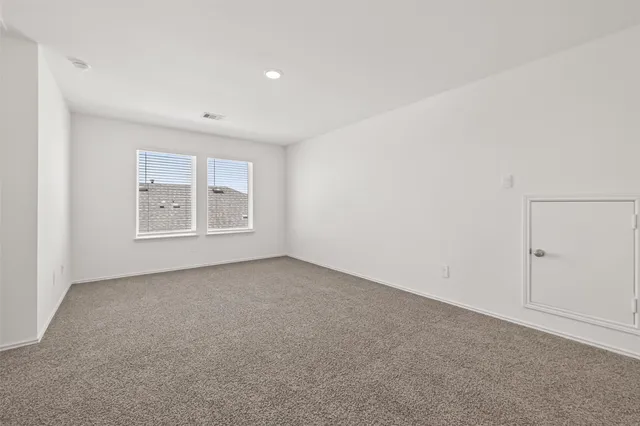 an empty room with a empty space and window