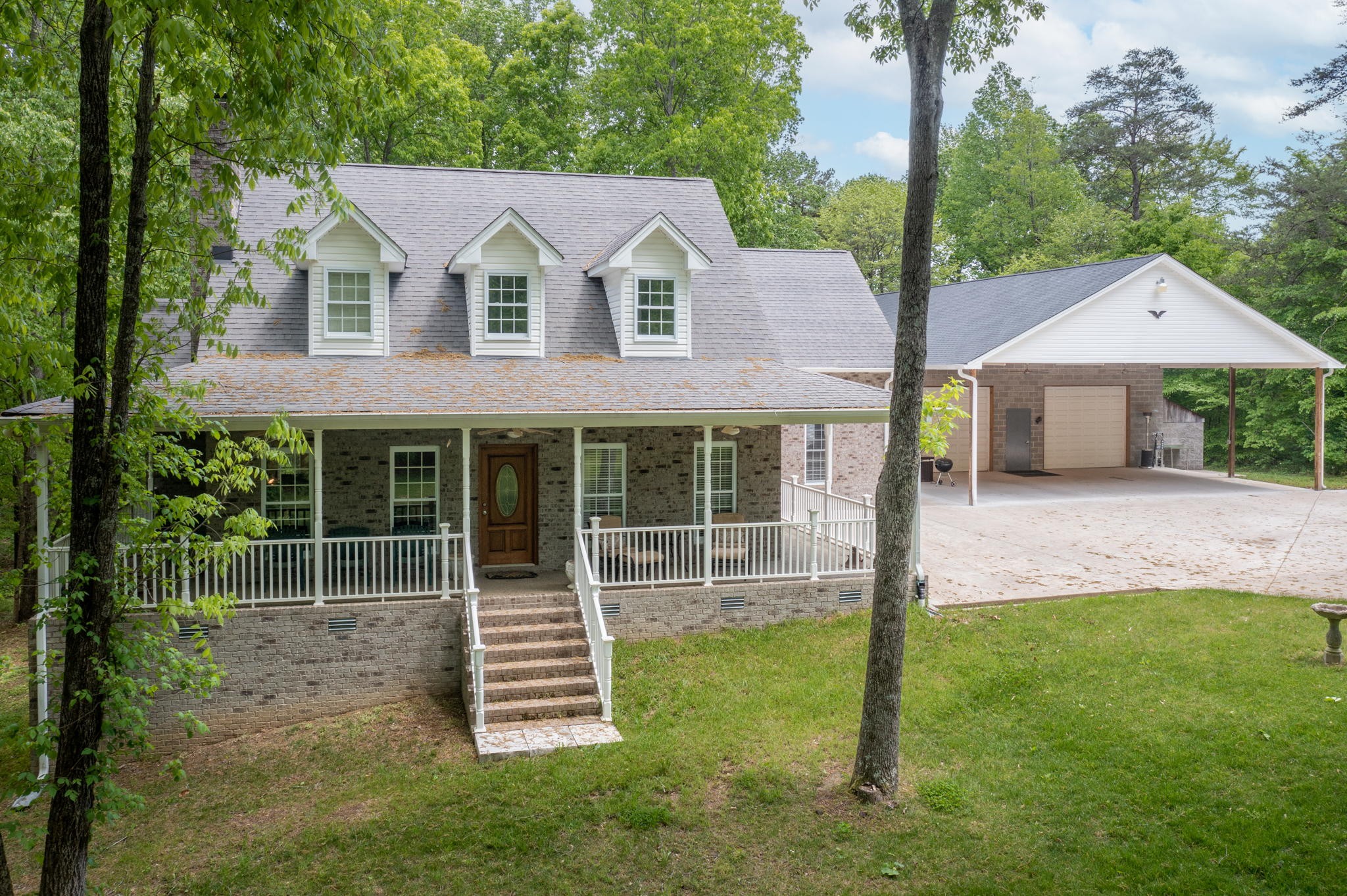 5298 Ridge Road Joelton, TN 37080 - Photo 1 of 46 a front view of a house with a garden