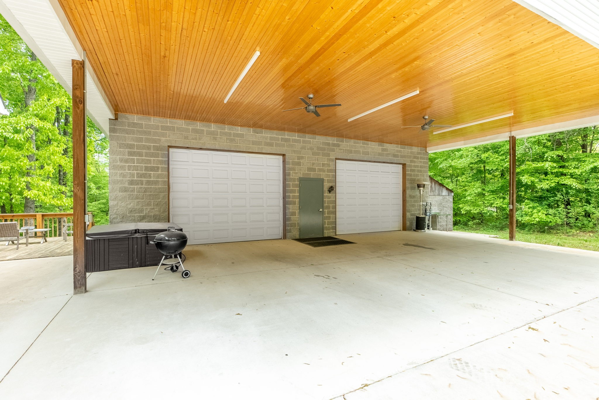 5298 Ridge Road Joelton, TN 37080 - Photo 11 of 46 a view of a house with a backyard and floor to ceiling windows
