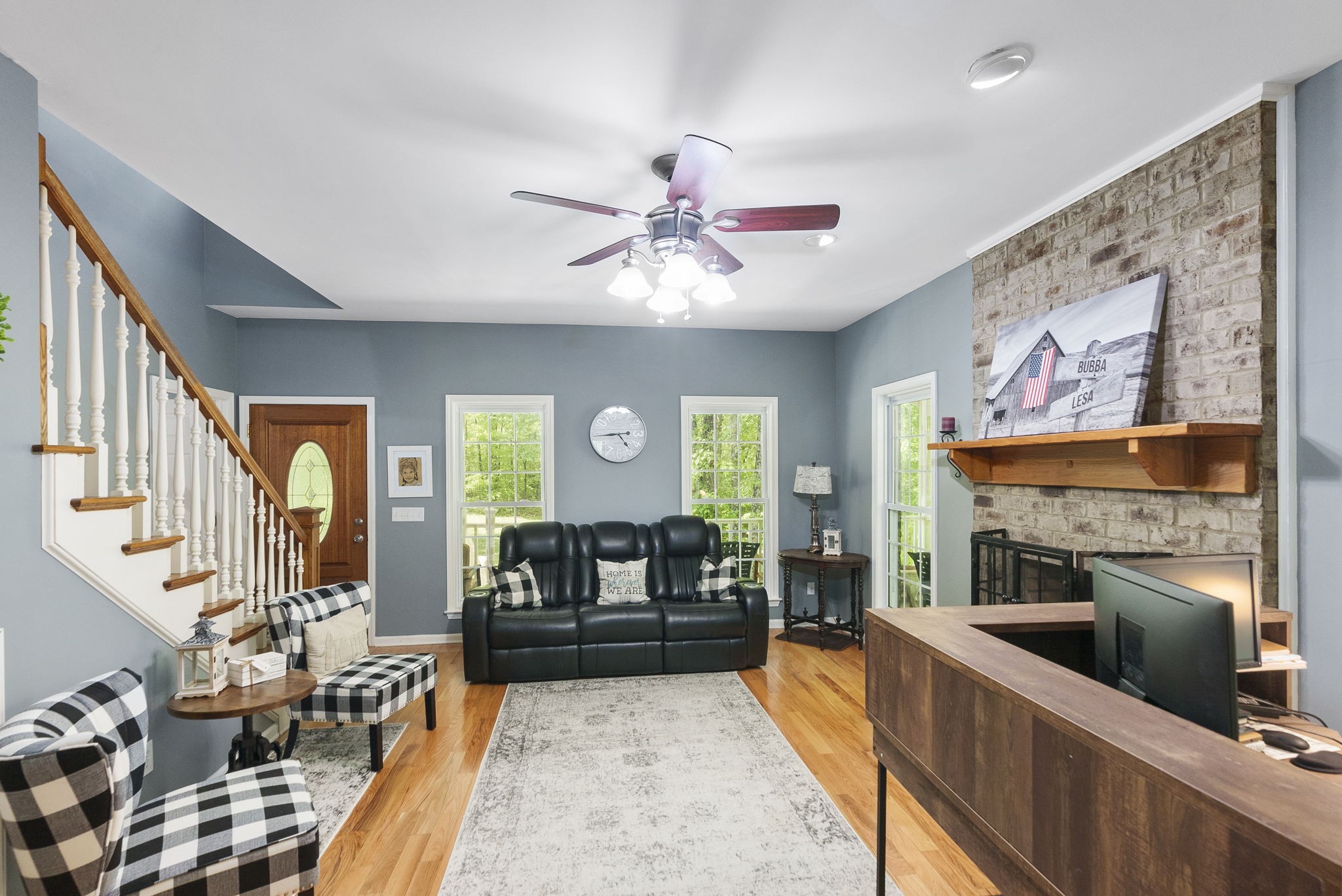 5298 Ridge Road Joelton, TN 37080 - Photo 14 of 46 a living room with furniture a fireplace and a flat screen tv